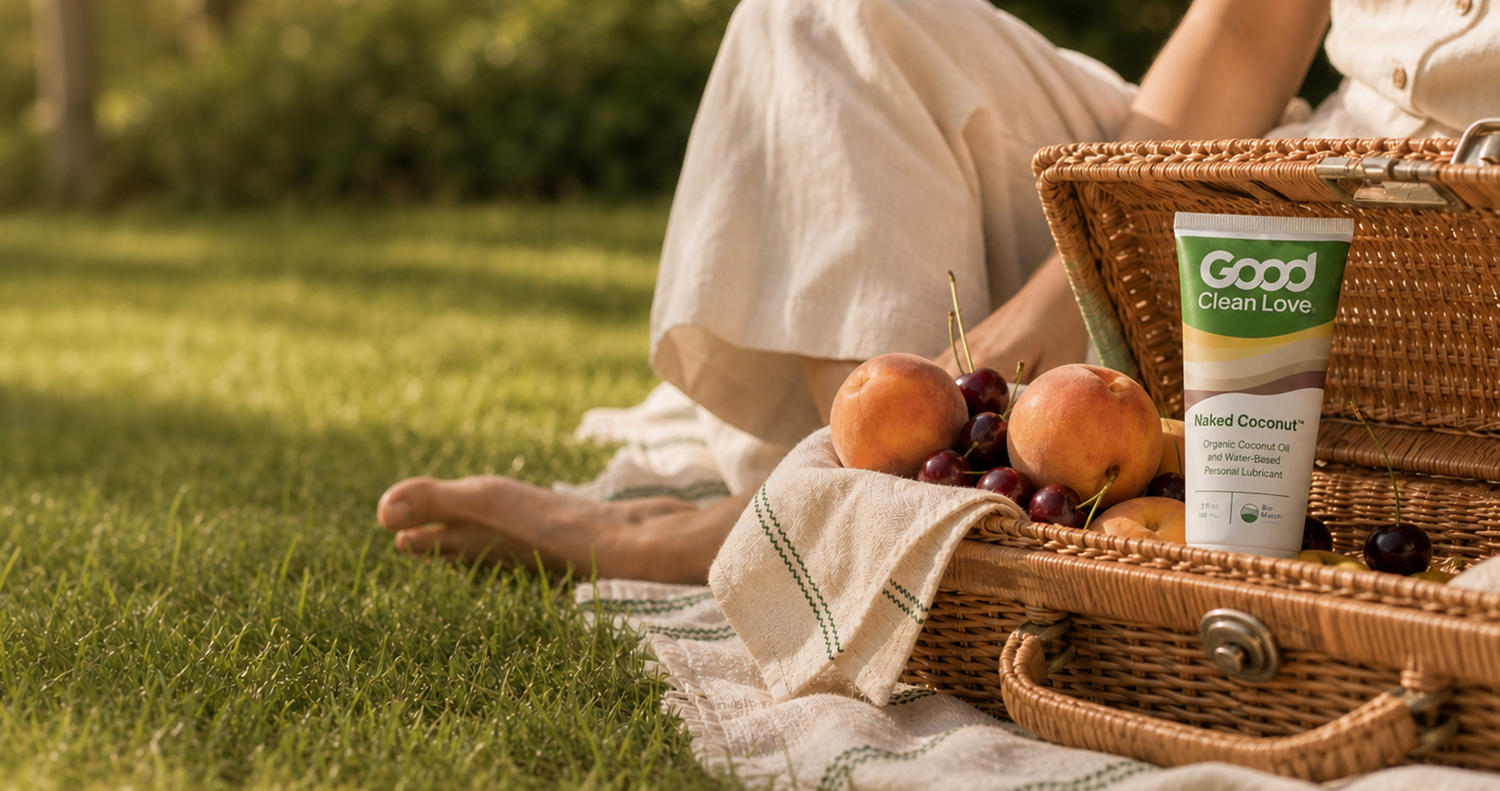 Picnic basket with peaches, cherries, and naked coconut.